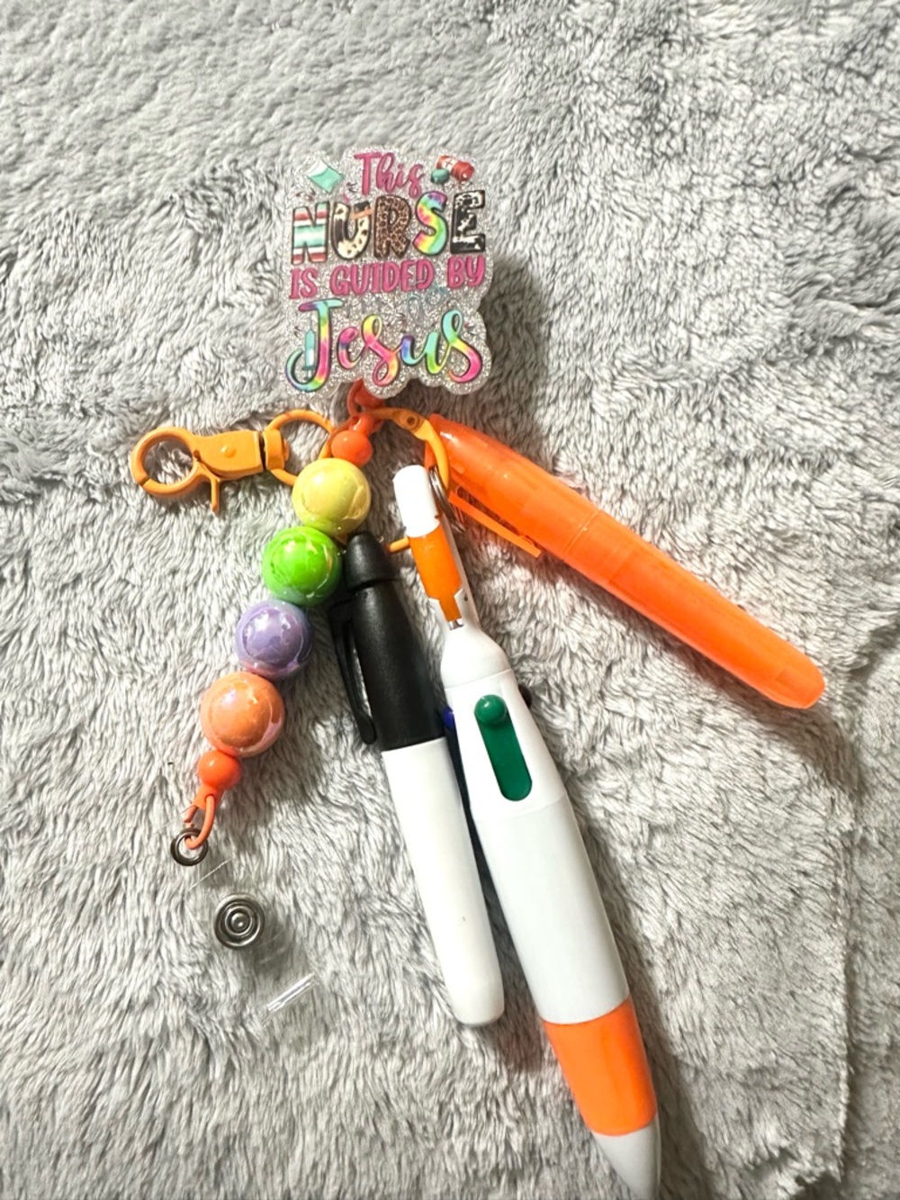This Nurse Is Guided by Jesus Badge Reel with Accessories- Orange & Multicolor